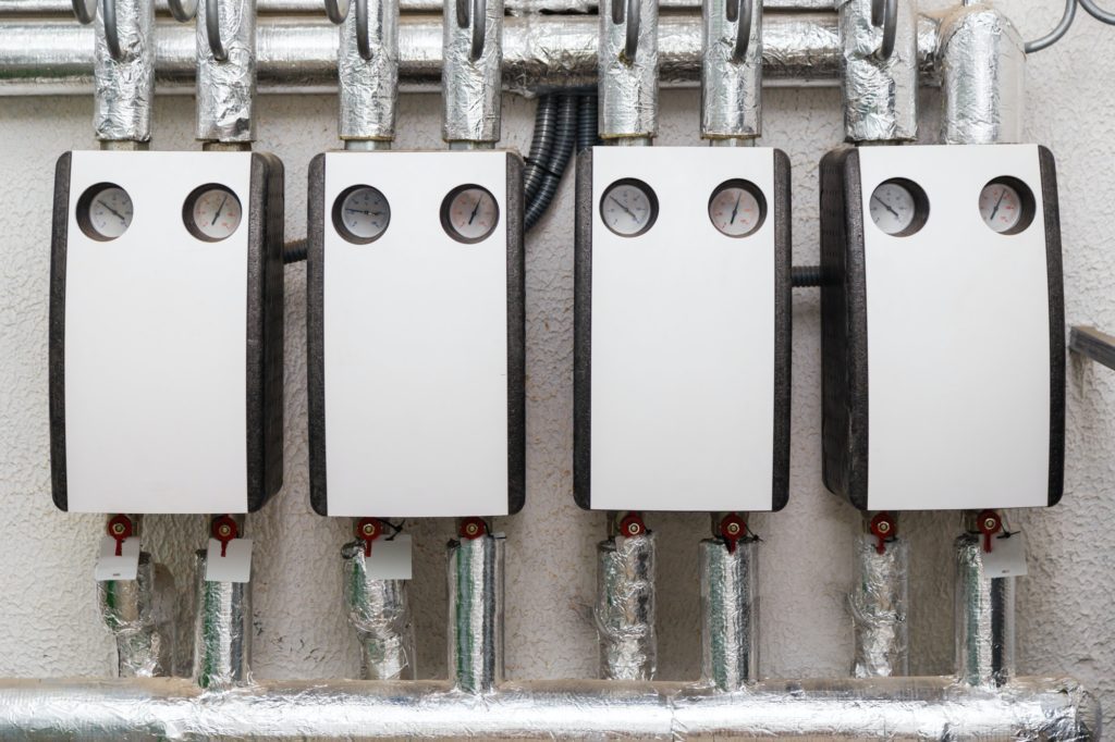 Group of hot water circulating pumps installed in boiler room